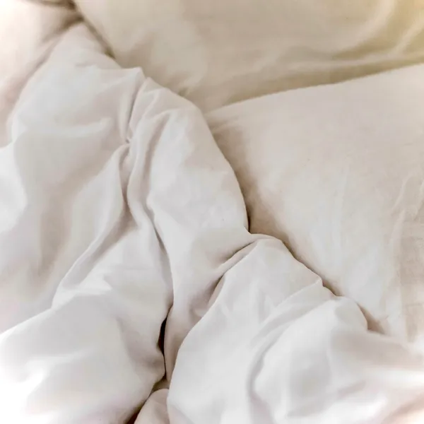 Fresh white bed linens